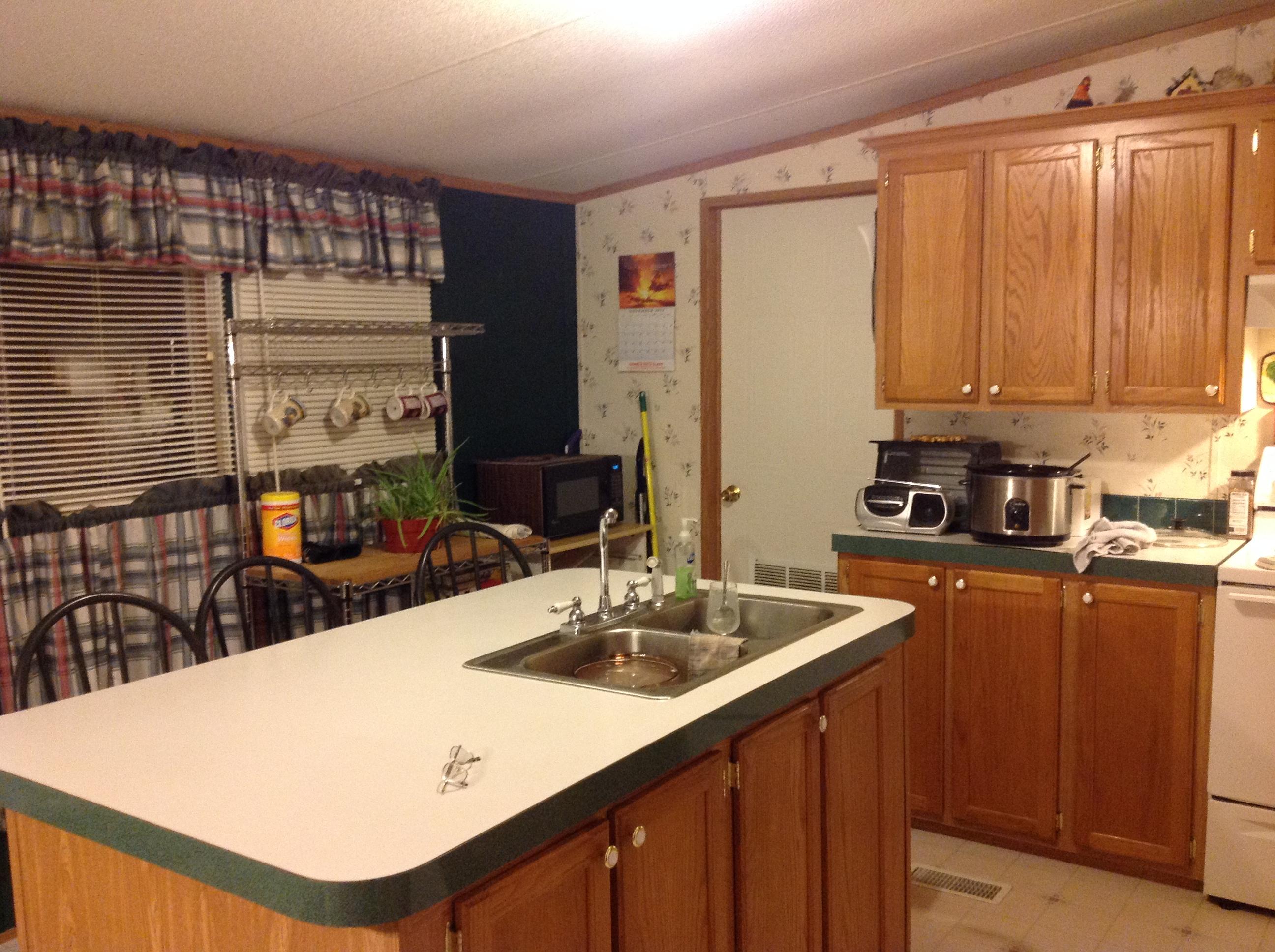 1763 Harmony School Road Hardy, VA 24101 - Photo 2 of 11 a kitchen with kitchen island a sink table and chairs