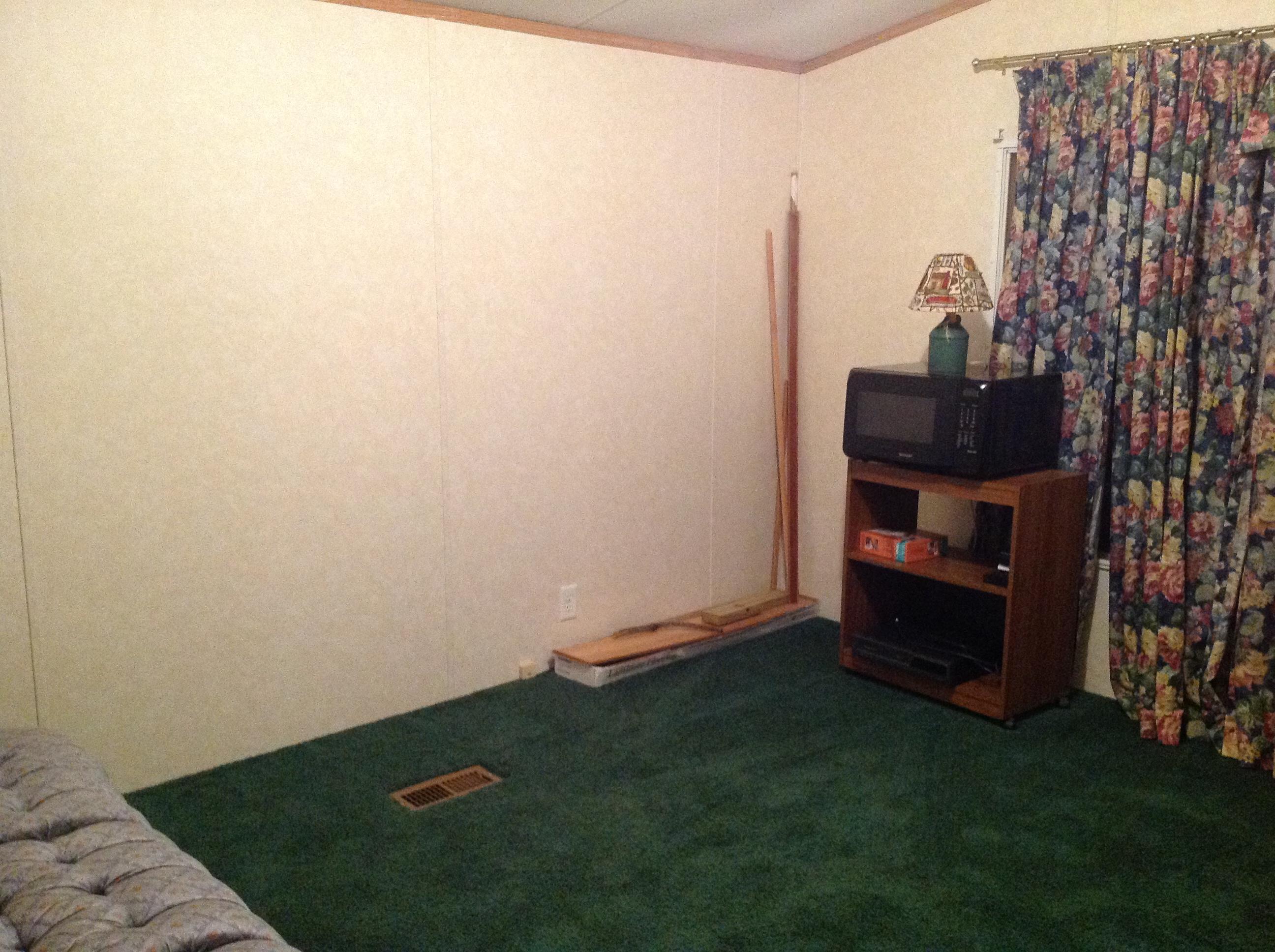 1763 Harmony School Road Hardy, VA 24101 - Photo 8 of 11 a view of an empty room with wooden floor and a cabinet