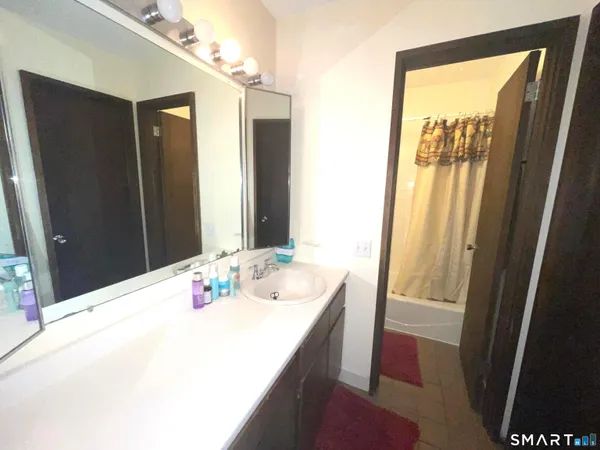 a bedroom with a bed and a closet