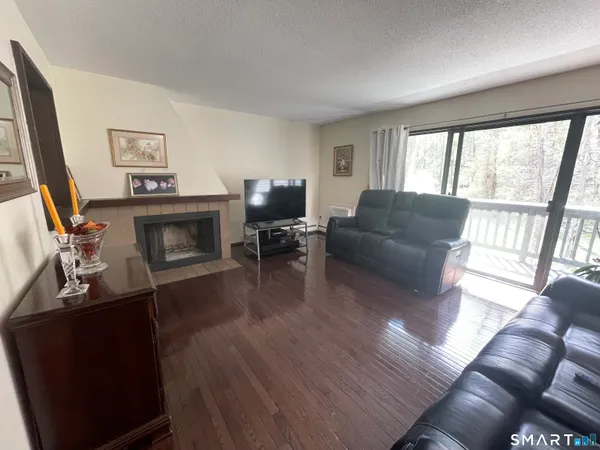 a room that has a mirror and a wooden floor