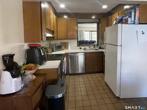 a kitchen with a sink cabinets and window