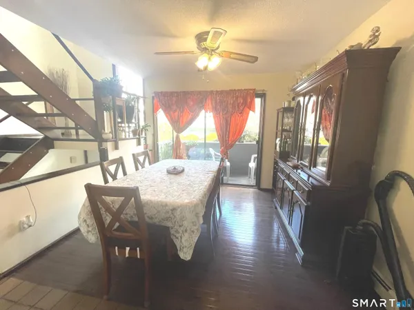 a spacious bedroom with a bed and a lamp