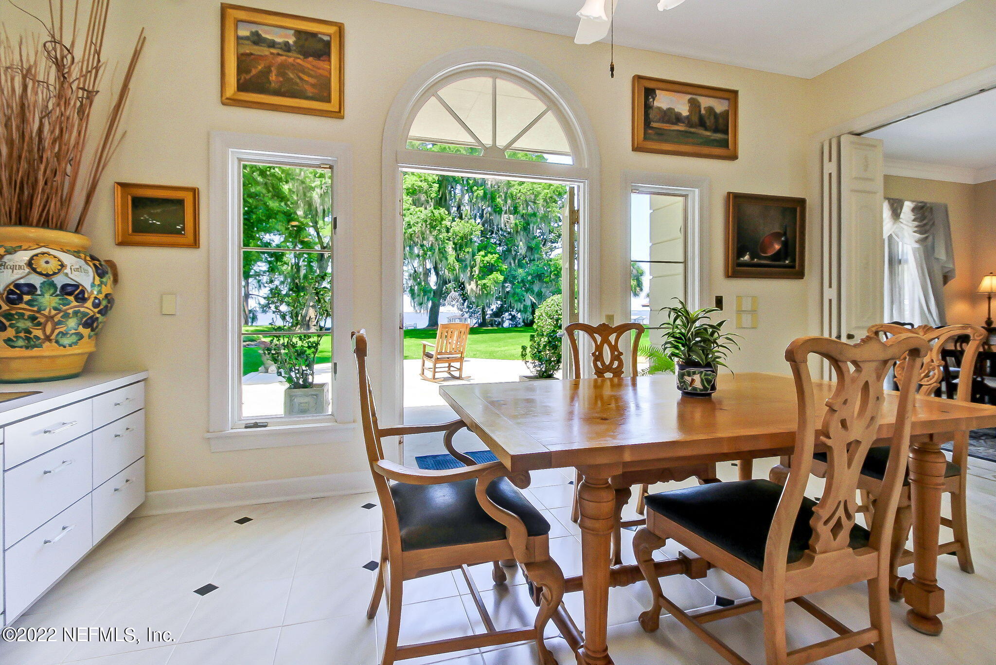 3520 Point Pleasant Road Jacksonville, FL 32217 - Photo 15 of 37 a view of a dining room with furniture and a potted plant