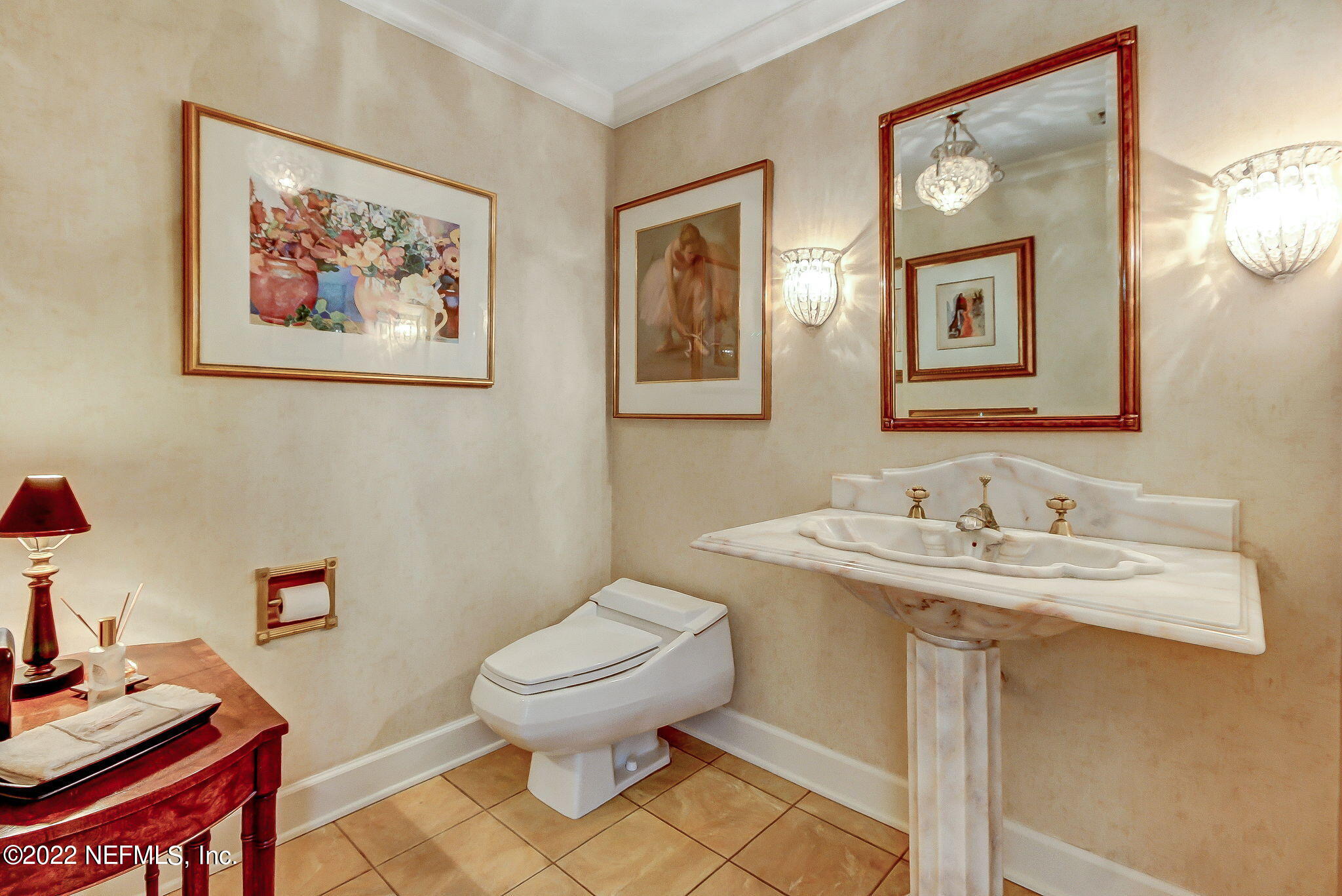 3520 Point Pleasant Road Jacksonville, FL 32217 - Photo 20 of 37 a bathroom with a toilet a sink and a mirror