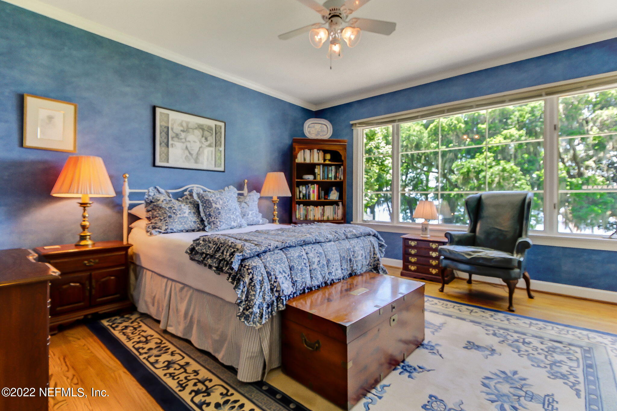 3520 Point Pleasant Road Jacksonville, FL 32217 - Photo 27 of 37 a bedroom with a bed and a chandelier