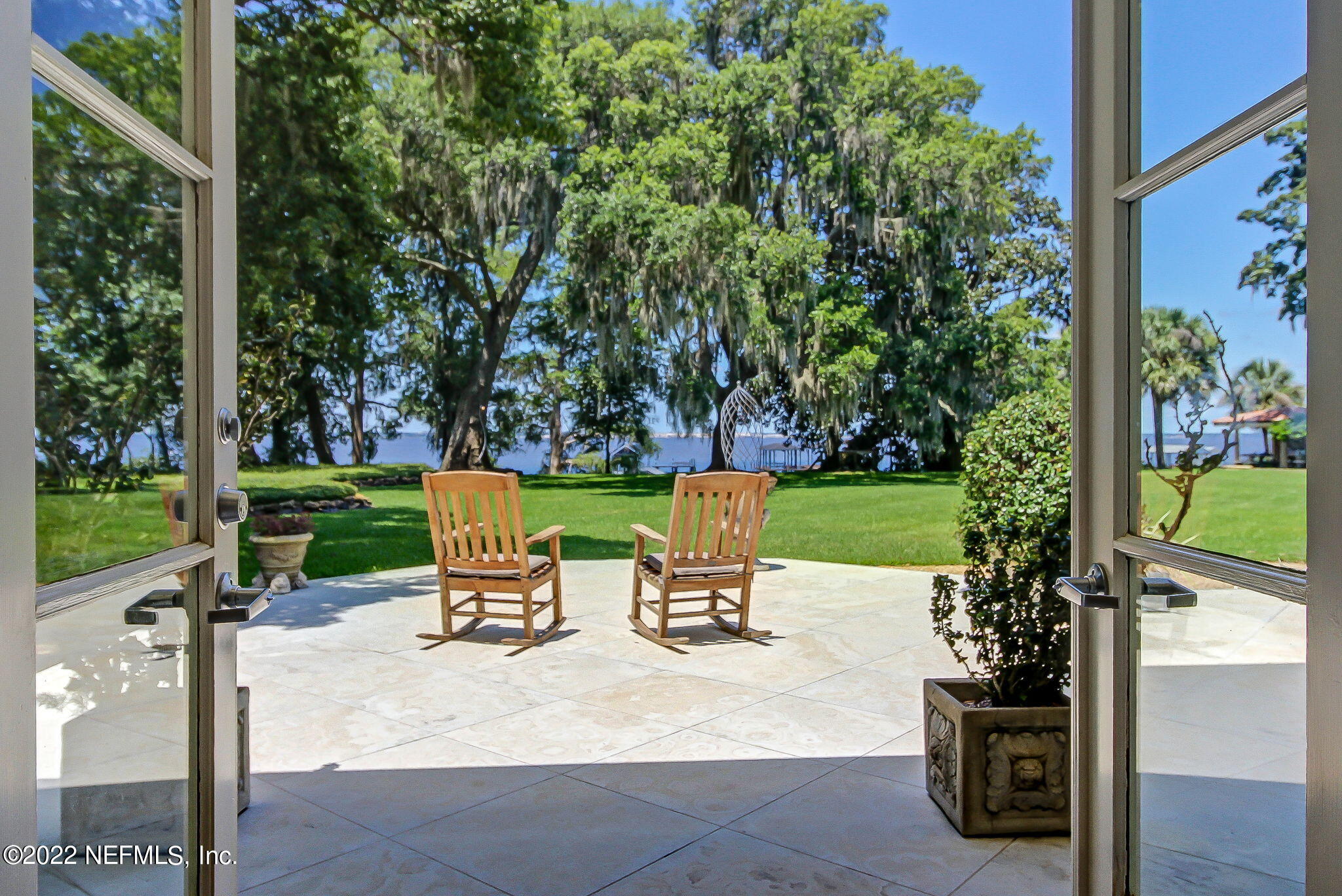 3520 Point Pleasant Road Jacksonville, FL 32217 - Photo 7 of 37 a chair and table with chairs in backyard of the house