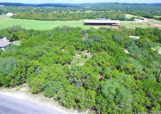 a view of a lush green field with lots of green space