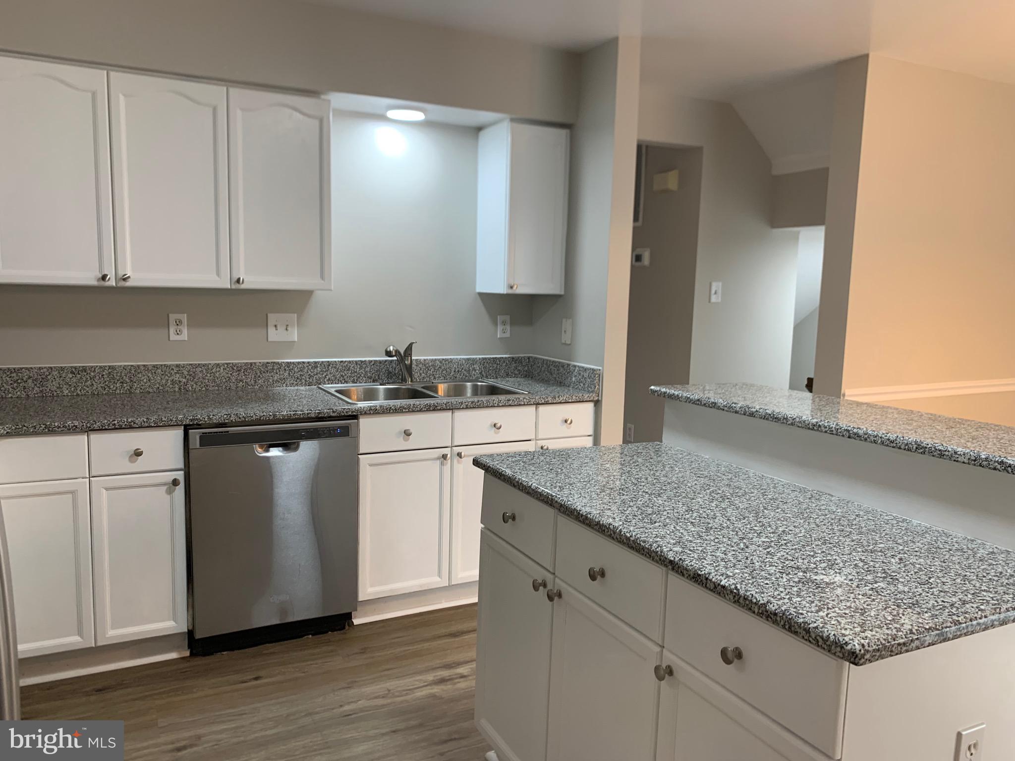 114 Sentry Ridge Smithsburg, MD 21783 - Photo 13 of 60 a kitchen with granite countertop a sink and cabinets
