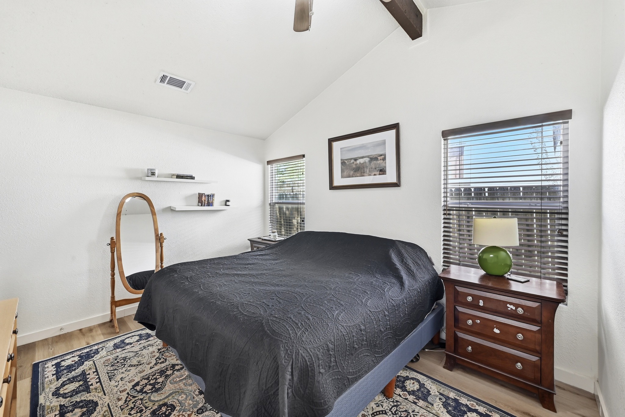 5610 Fence Row Austin, TX 78744 - Photo 13 of 26 Bedroom featuring light flooring, lofted ceiling with beams, and a ceiling fan
