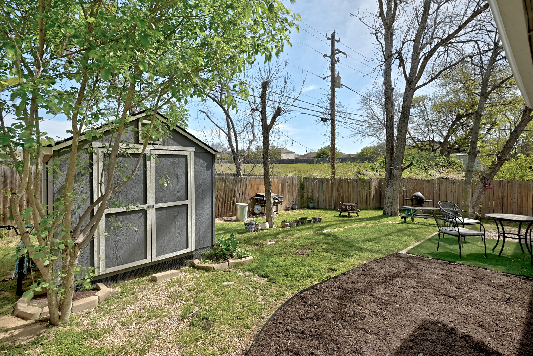 5610 Fence Row Austin, TX 78744 - Photo 24 of 26 View of the yard and shed.