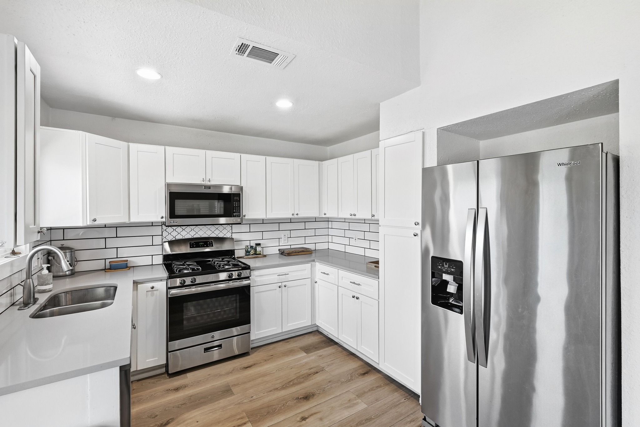5610 Fence Row Austin, TX 78744 - Photo 7 of 26 Side by side refrigerator with icemaker.