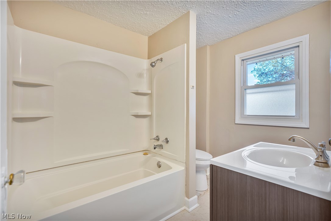 2910 13th Street Northwest Canton, OH 44708 - Photo 22 of 35 Updated bathroom includes new vanity, countertop, faucet and toilet
