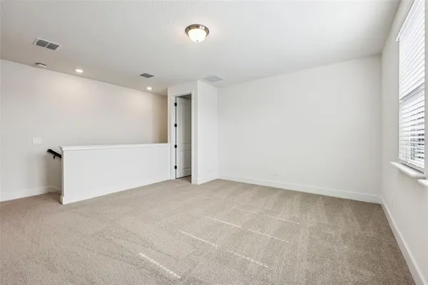 an empty room with a empty space and window
