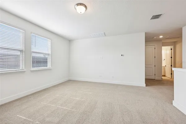 a bathroom with a toilet a sink and a mirror