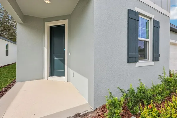 a view of a bedroom from a hallway
