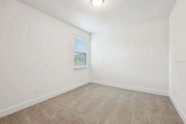 a view of a porch and garden