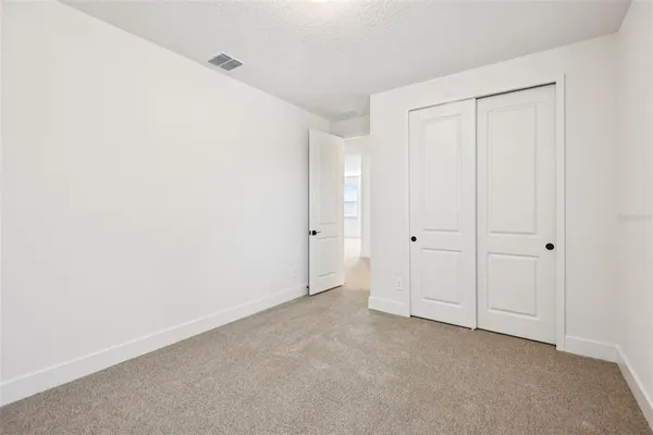 a bedroom with windows