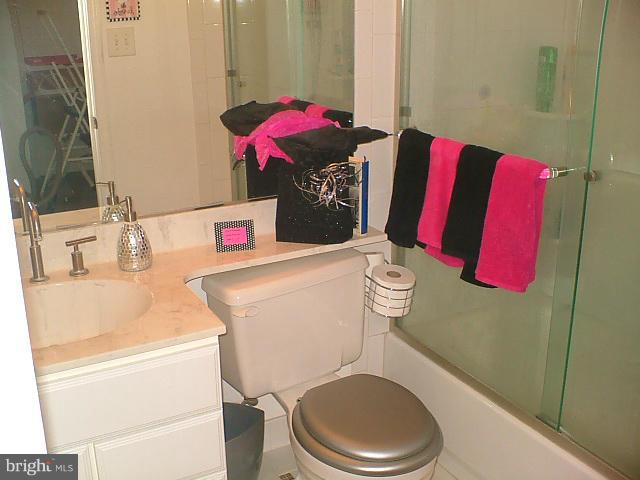 19529 Olney Mill Road Olney, MD 20832 - Photo 5 of 10 a bathroom with a toilet sink vanity tub and shower