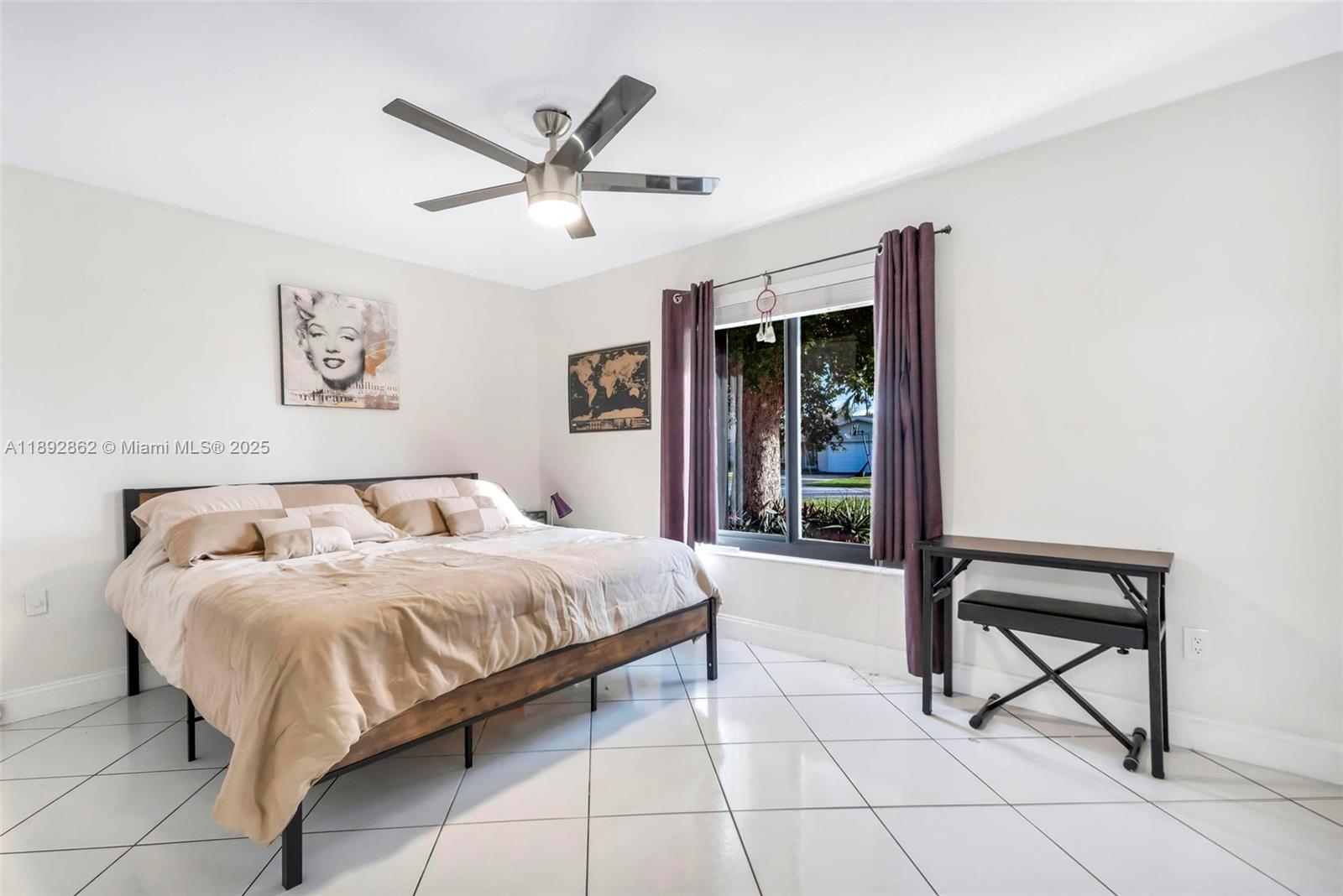 8111 Southwest 205th Street Cutler Bay, FL 33189 - Photo 14 of 51 a bedroom with a bed and a ceiling fan