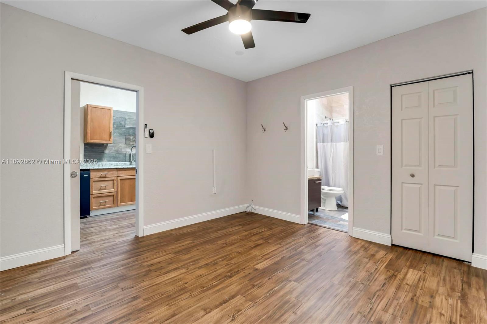 8111 Southwest 205th Street Cutler Bay, FL 33189 - Photo 21 of 51 wooden floor in an empty room with a window