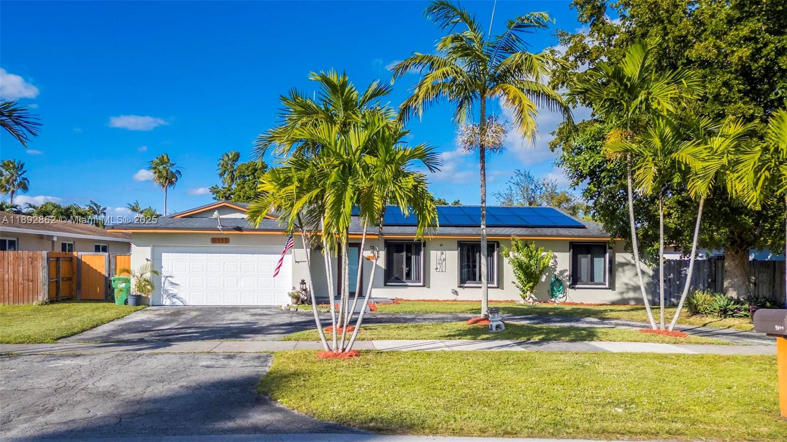 8111 Southwest 205th Street Cutler Bay, FL 33189 - Photo 24 of 51 a view of a house with swimming pool and a small yard