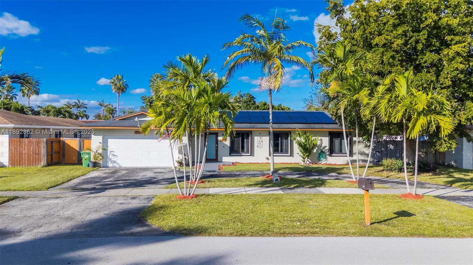 8111 Southwest 205th Street Cutler Bay, FL 33189 - Photo 27 of 51 a view of a swimming pool with a table and chairs