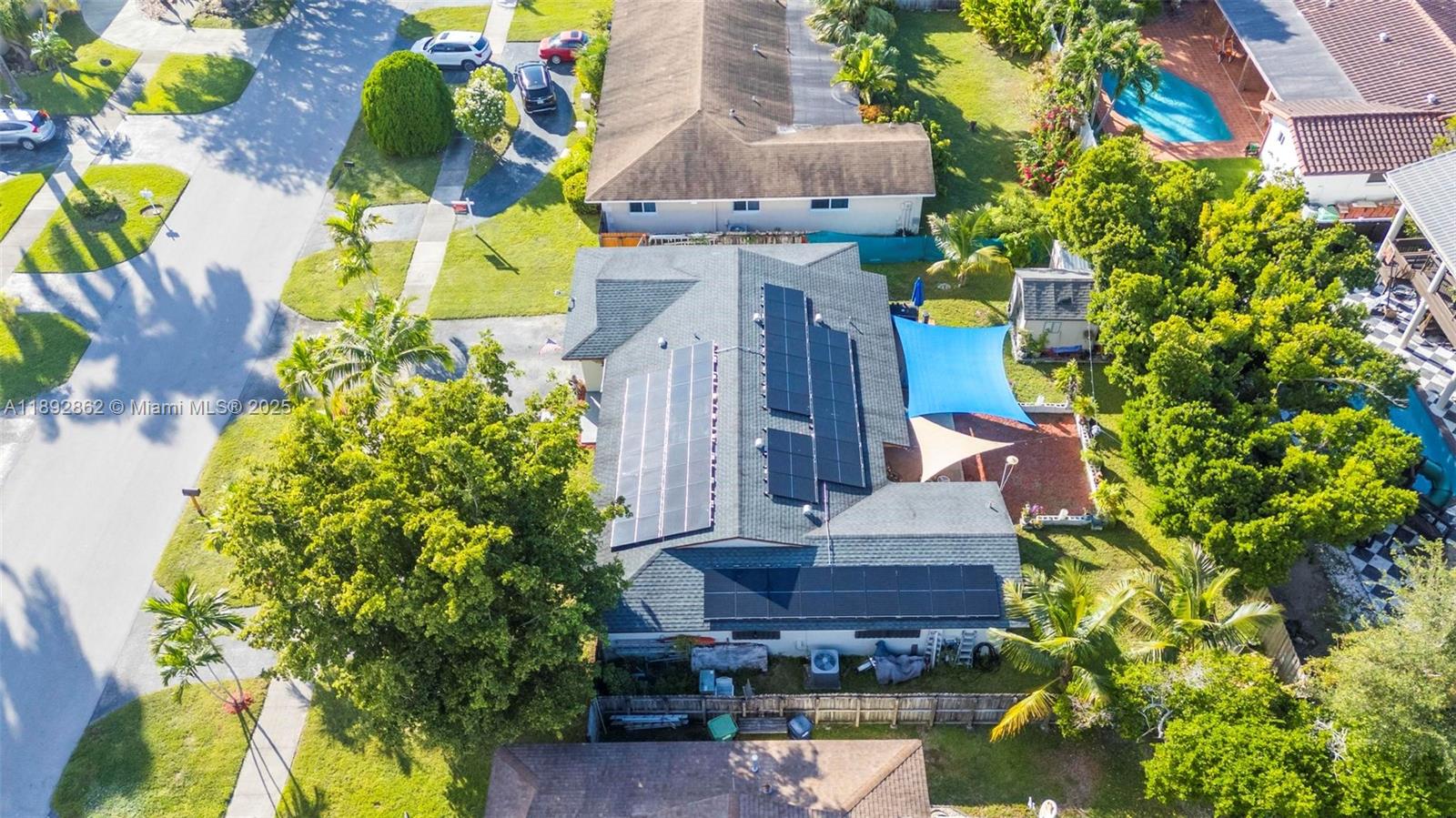 8111 Southwest 205th Street Cutler Bay, FL 33189 - Photo 33 of 51 an aerial view of a house with a yard and garden in front of it