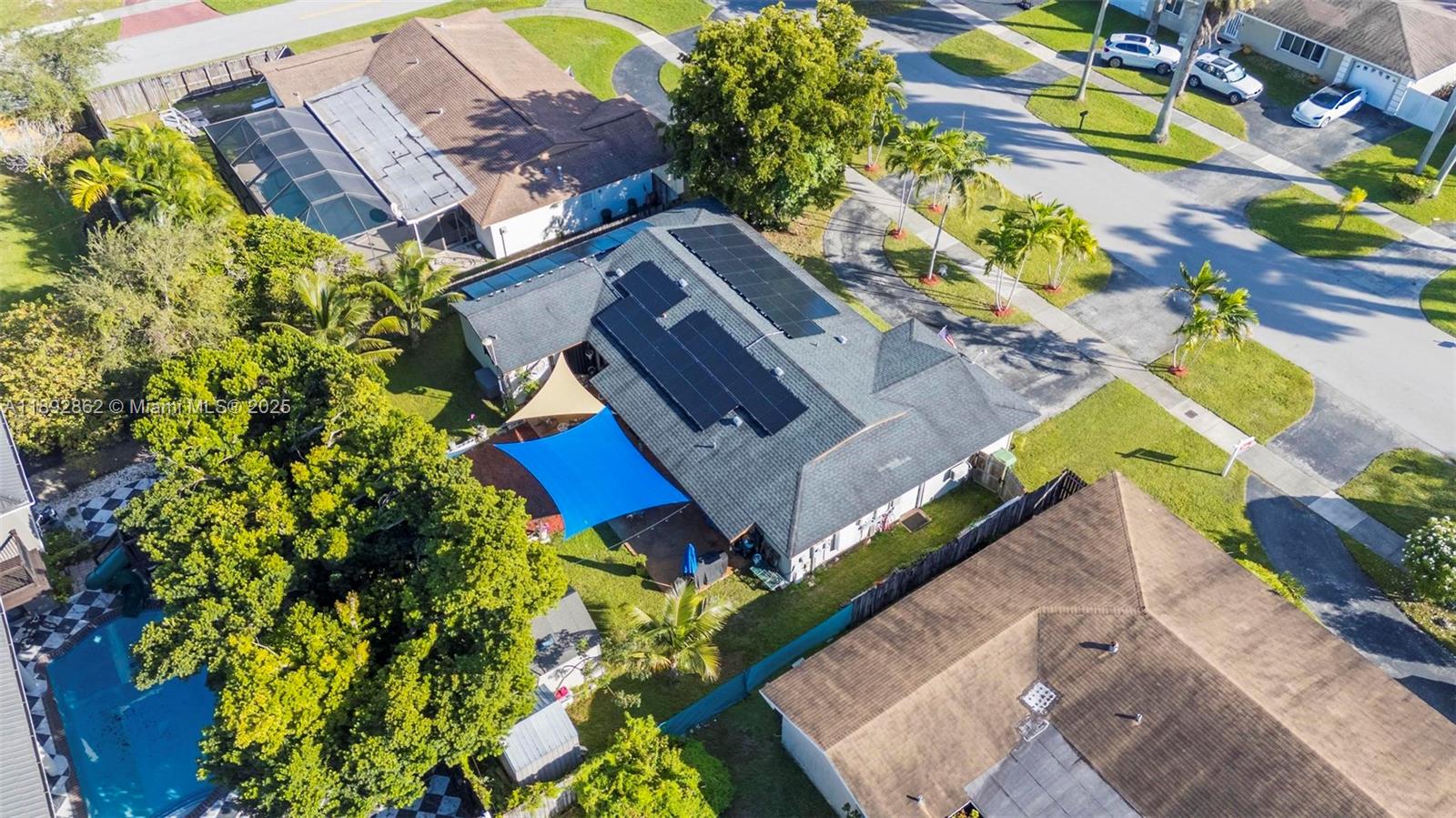8111 Southwest 205th Street Cutler Bay, FL 33189 - Photo 36 of 51 an aerial view of a house with a yard and garden