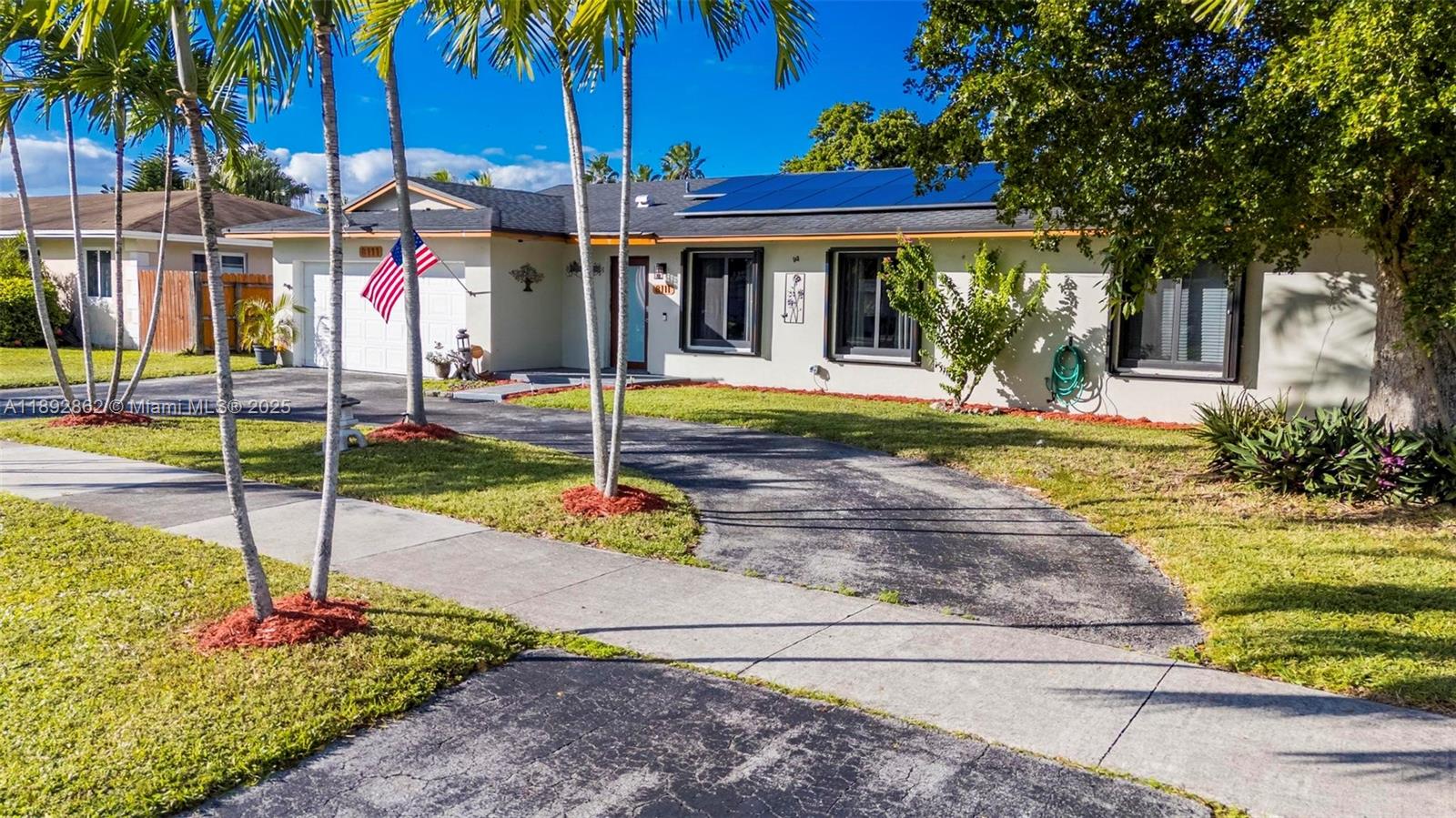 8111 Southwest 205th Street Cutler Bay, FL 33189 - Photo 39 of 51 a view of a house with backyard and swimming pool
