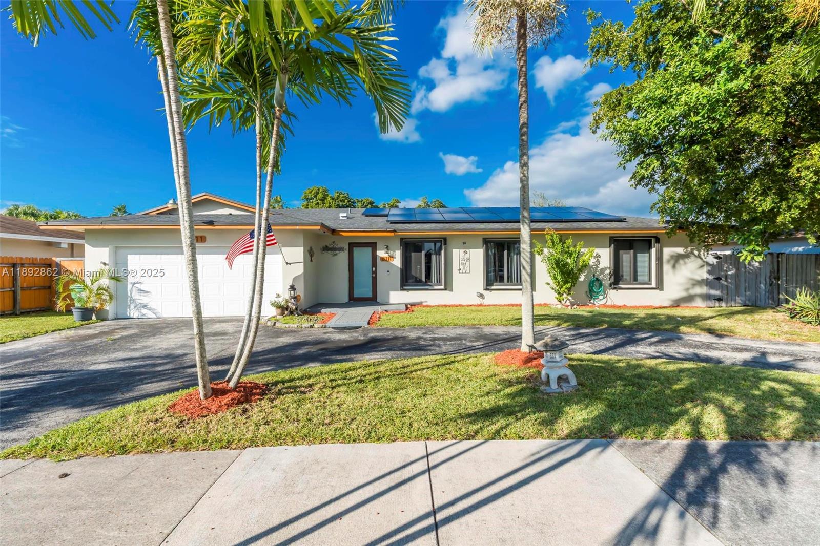 8111 Southwest 205th Street Cutler Bay, FL 33189 - Photo 41 of 51 a front view of a house with garden