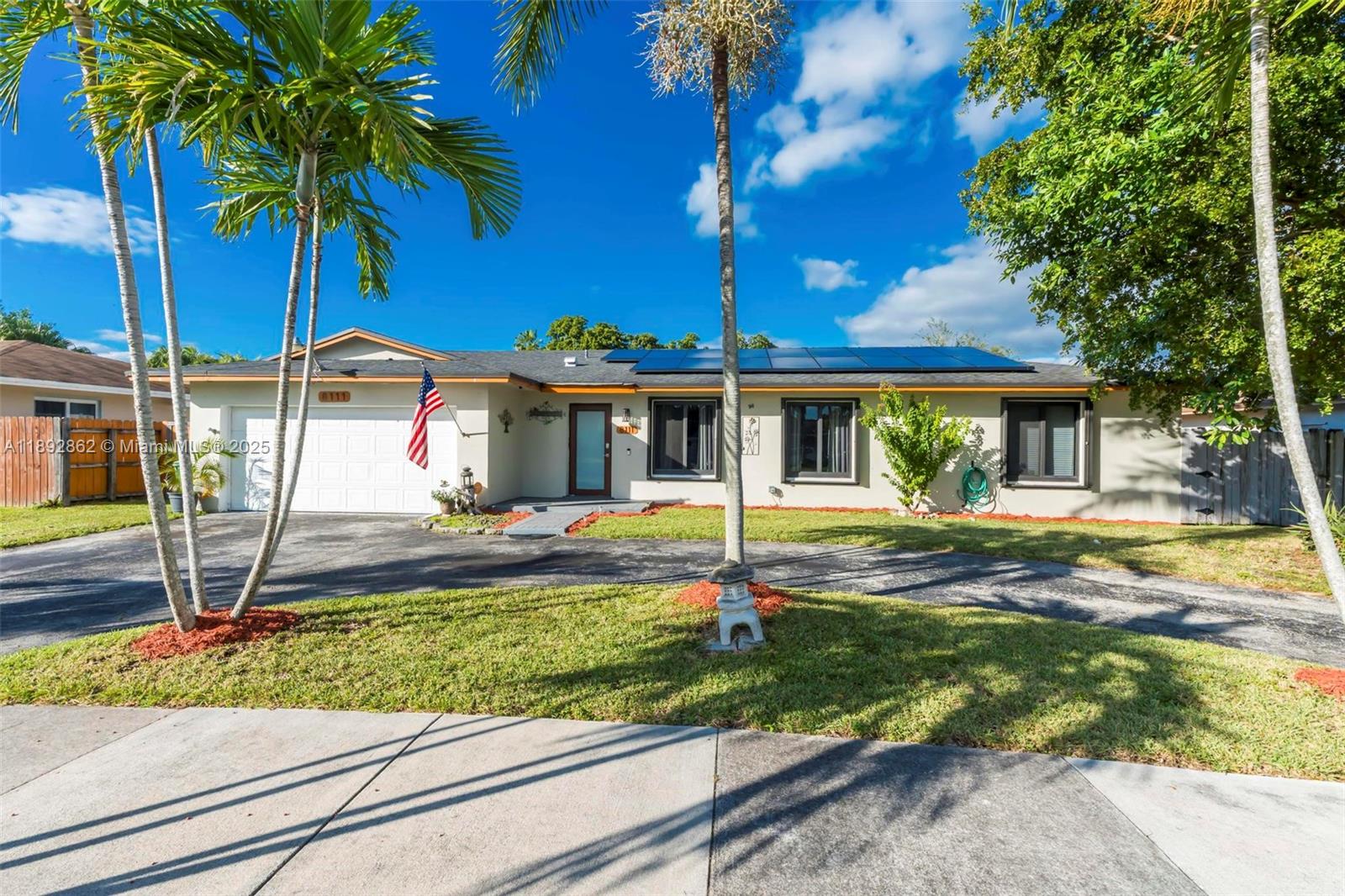 8111 Southwest 205th Street Cutler Bay, FL 33189 - Photo 42 of 51 a front view of a house with garden