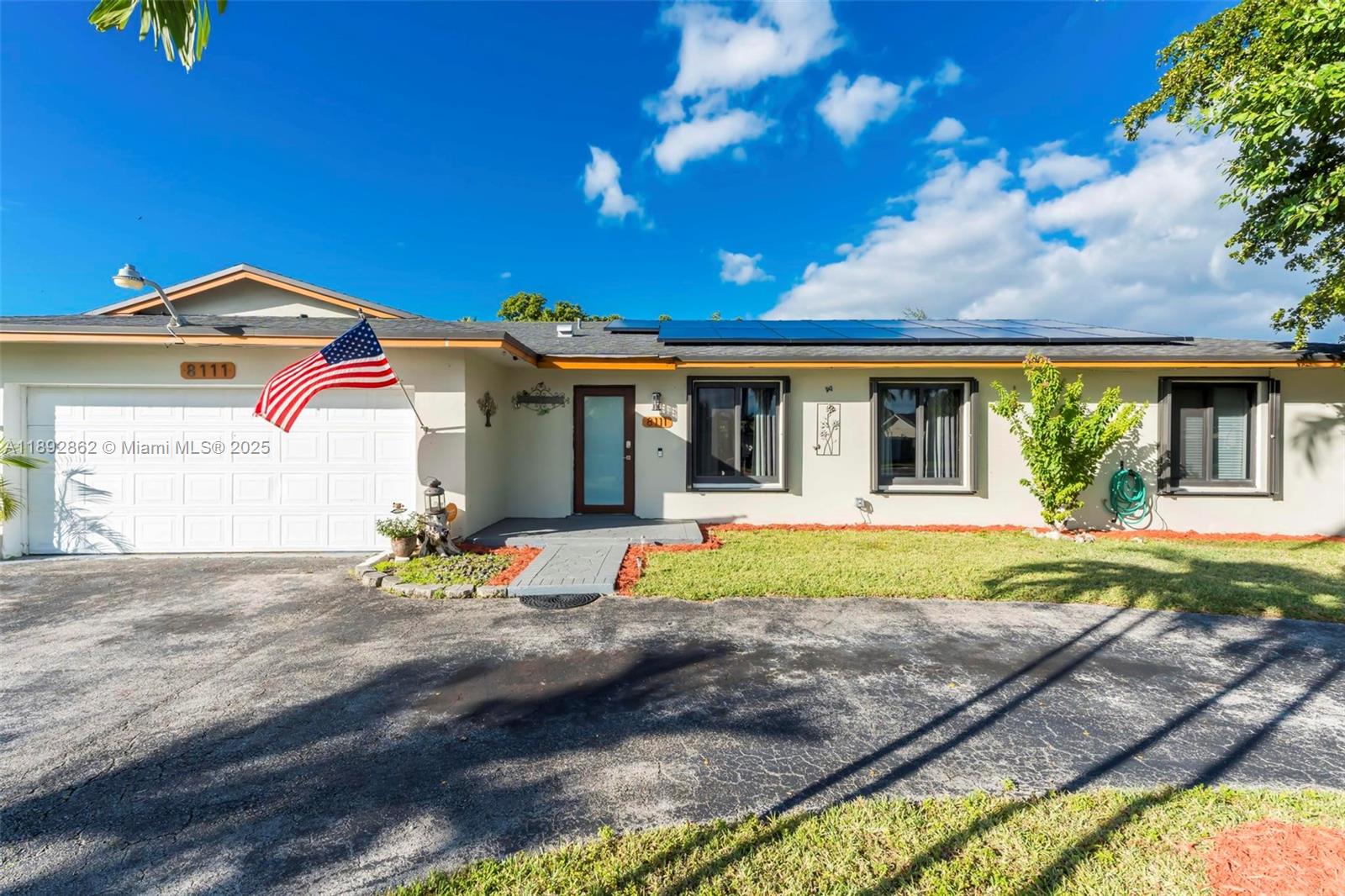8111 Southwest 205th Street Cutler Bay, FL 33189 - Photo 44 of 51 a front view of a house with a yard