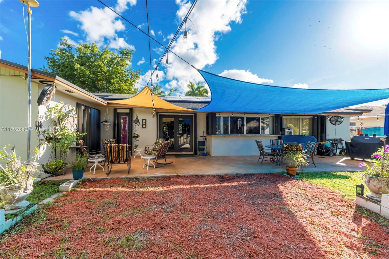 8111 Southwest 205th Street Cutler Bay, FL 33189 - Photo 47 of 51 a view of a house with backyard porch and sitting area