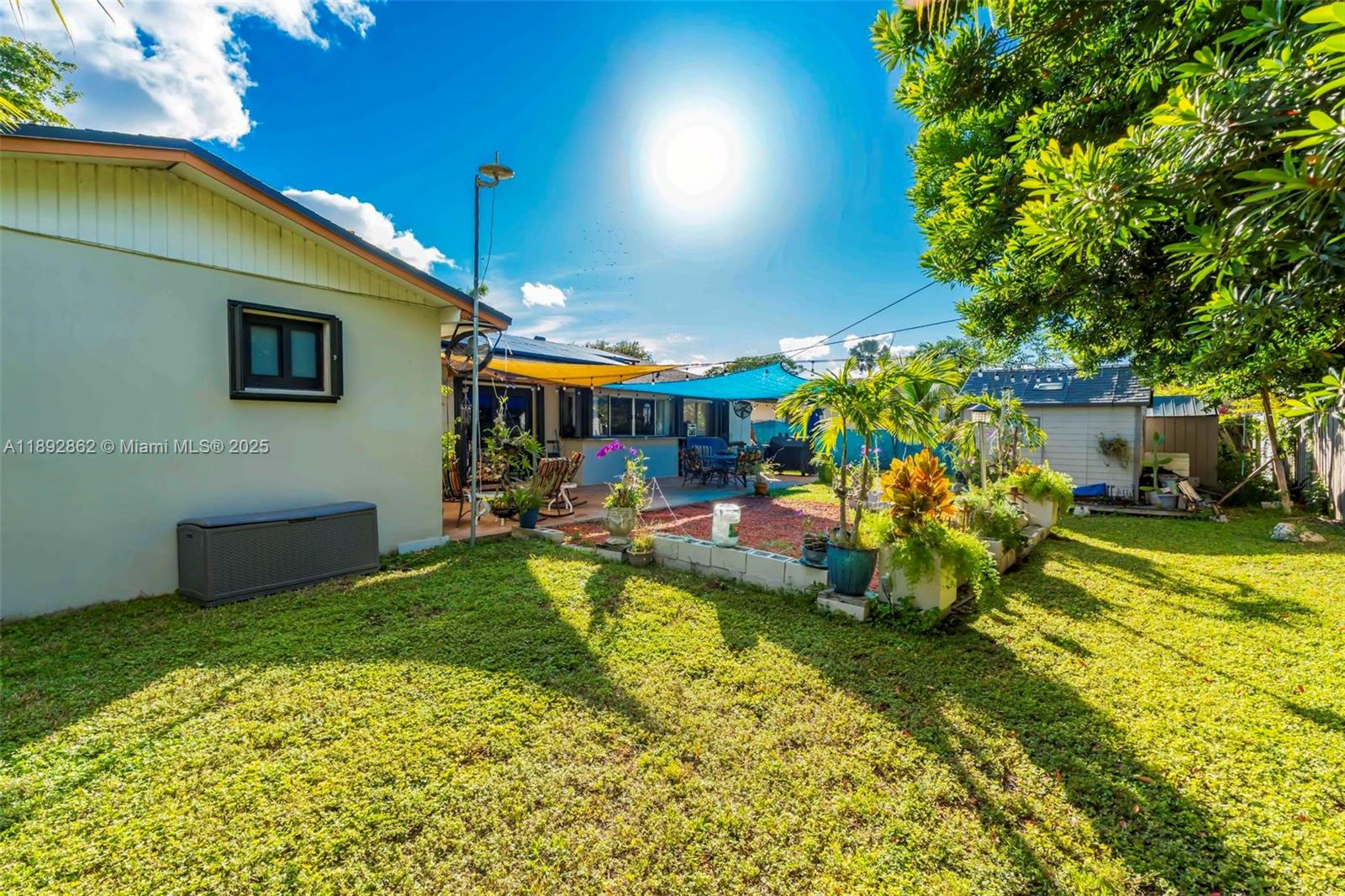8111 Southwest 205th Street Cutler Bay, FL 33189 - Photo 49 of 51 a view of a house with swimming pool and sitting area