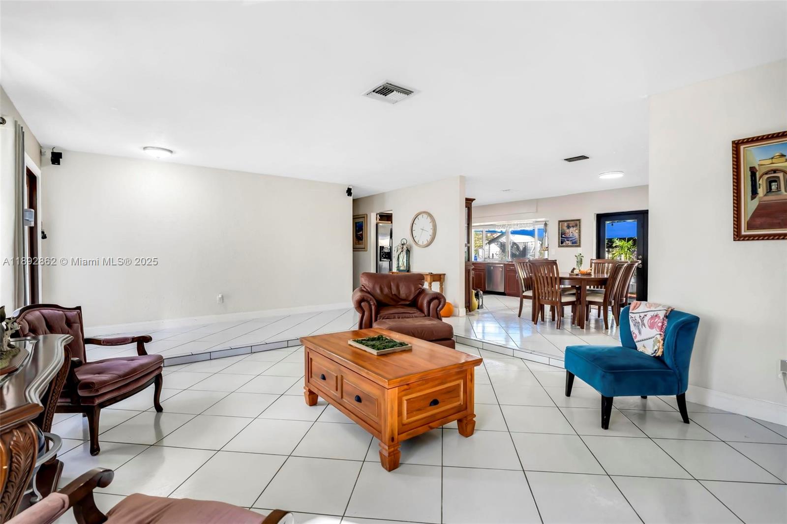 8111 Southwest 205th Street Cutler Bay, FL 33189 - Photo 5 of 51 a living room with furniture and a table