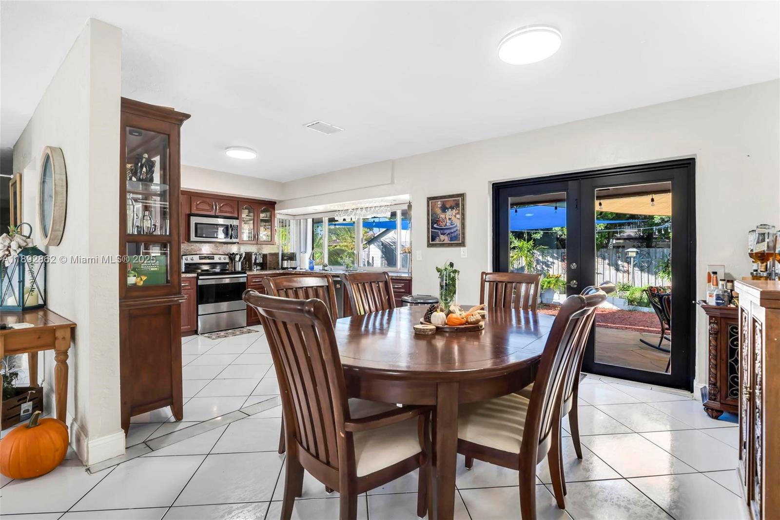 8111 Southwest 205th Street Cutler Bay, FL 33189 - Photo 6 of 51 a dining room with furniture and window