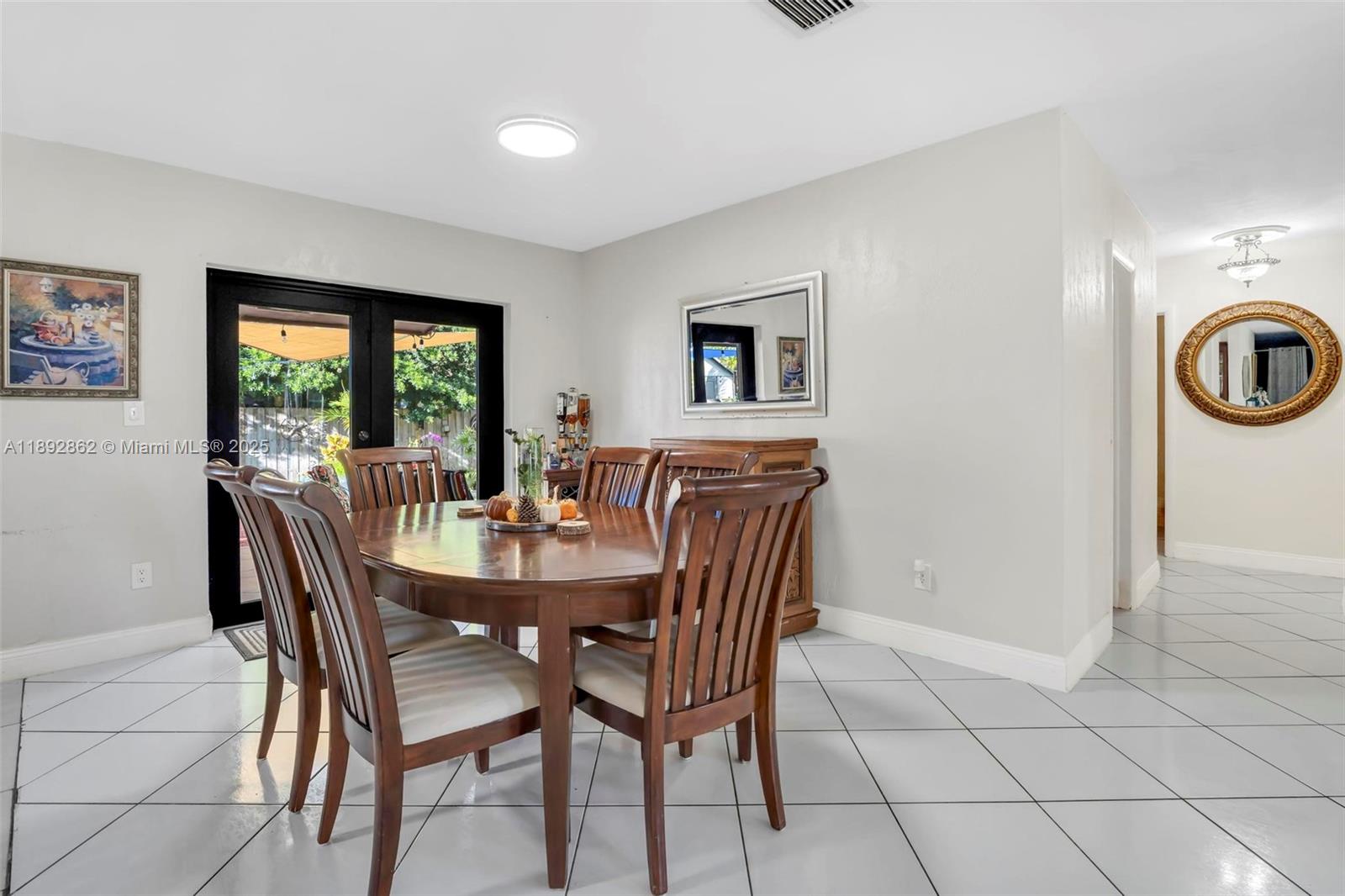 8111 Southwest 205th Street Cutler Bay, FL 33189 - Photo 7 of 51 a dining room with furniture and window