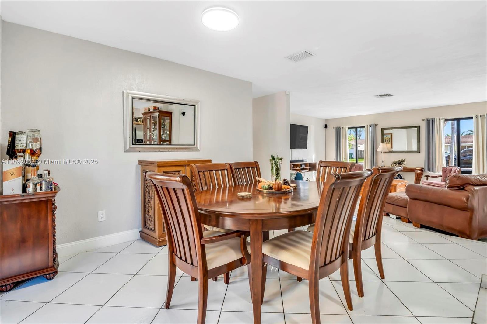 8111 Southwest 205th Street Cutler Bay, FL 33189 - Photo 8 of 51 a dining room with furniture and window