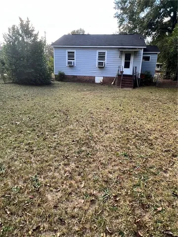 a backyard of a house with lots of green space
