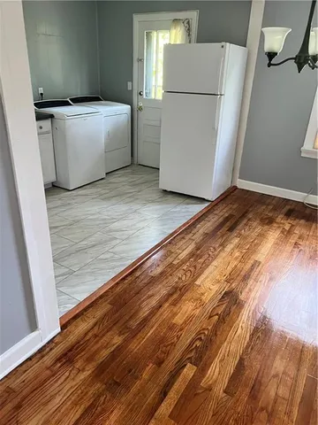 a white refrigerator freezer sitting in a kitchen