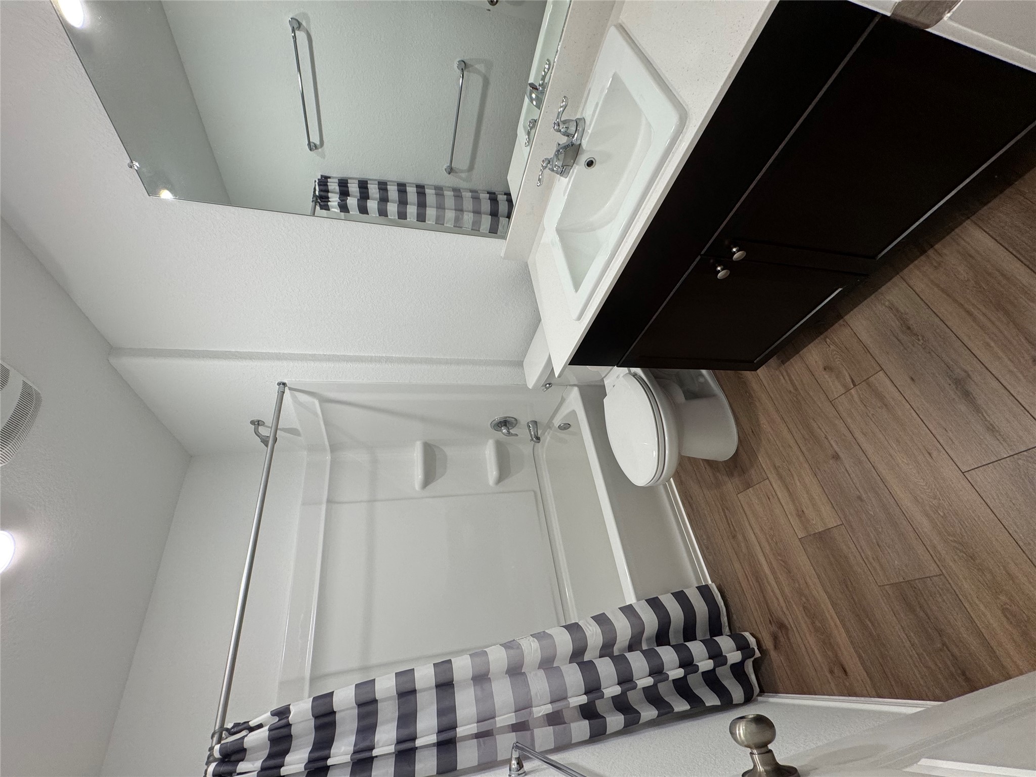 63 Trinity Circle Lockhart, TX 78644 - Photo 12 of 16 Guest bathroom features laminate flooring with ample storage.