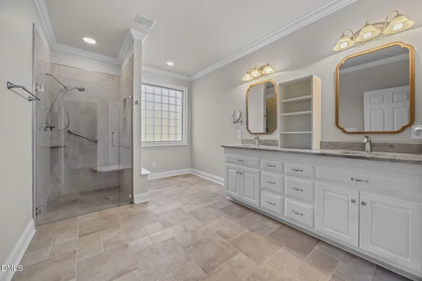 a bathroom with a granite countertop sink mirror and double