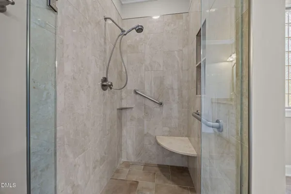 a bathroom with a shower and toilet