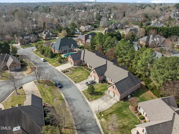an aerial view of a house with outdoor space