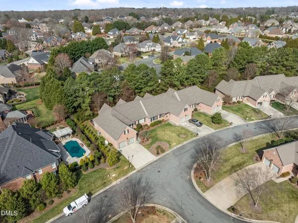 an aerial view of a house with outdoor space