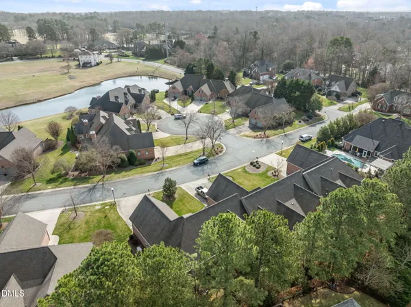 an aerial view of a house with outdoor space