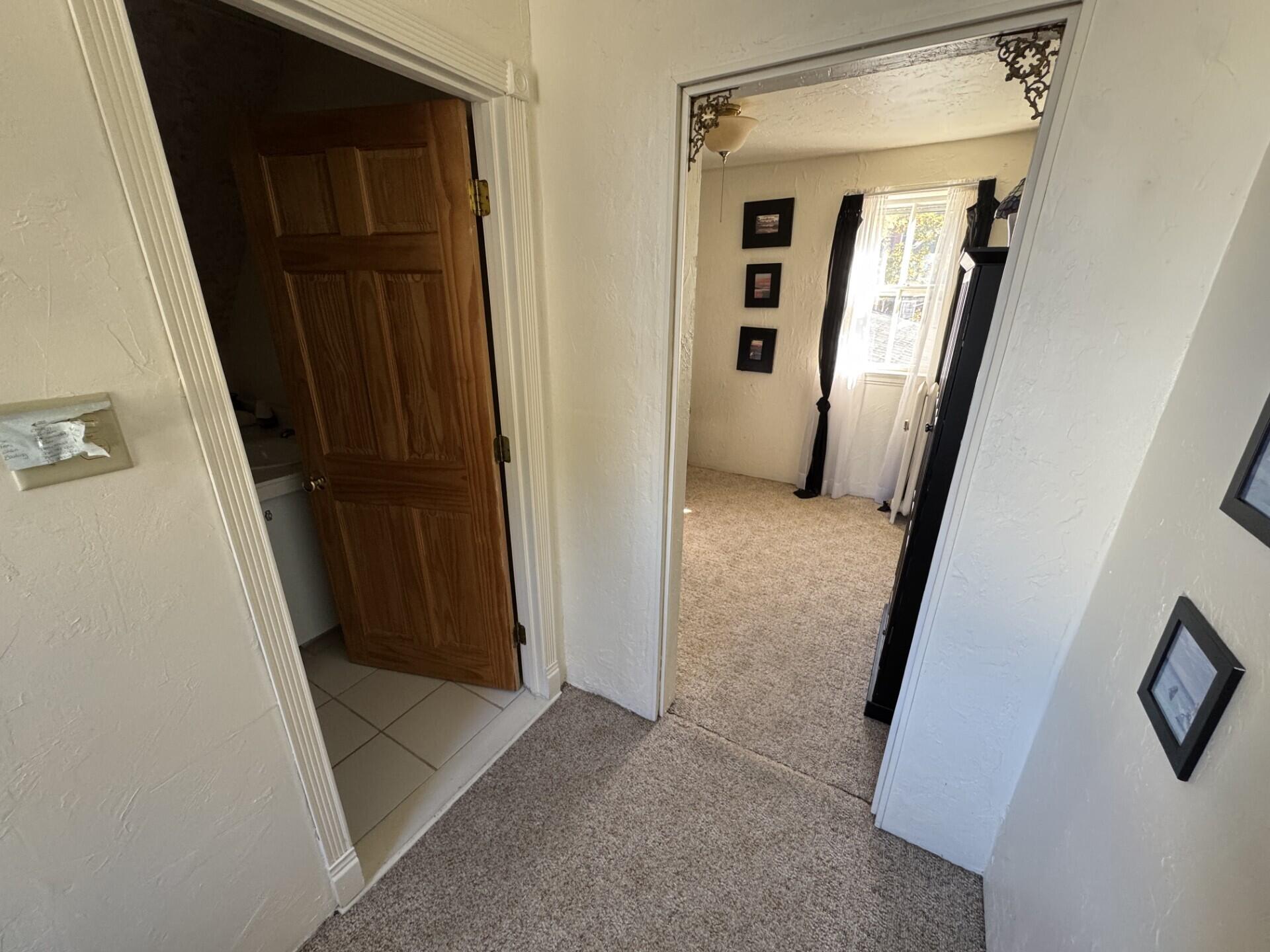 75 Elm Street Millinocket, ME 04462 - Photo 27 of 37 Toward full bath & Bedroom