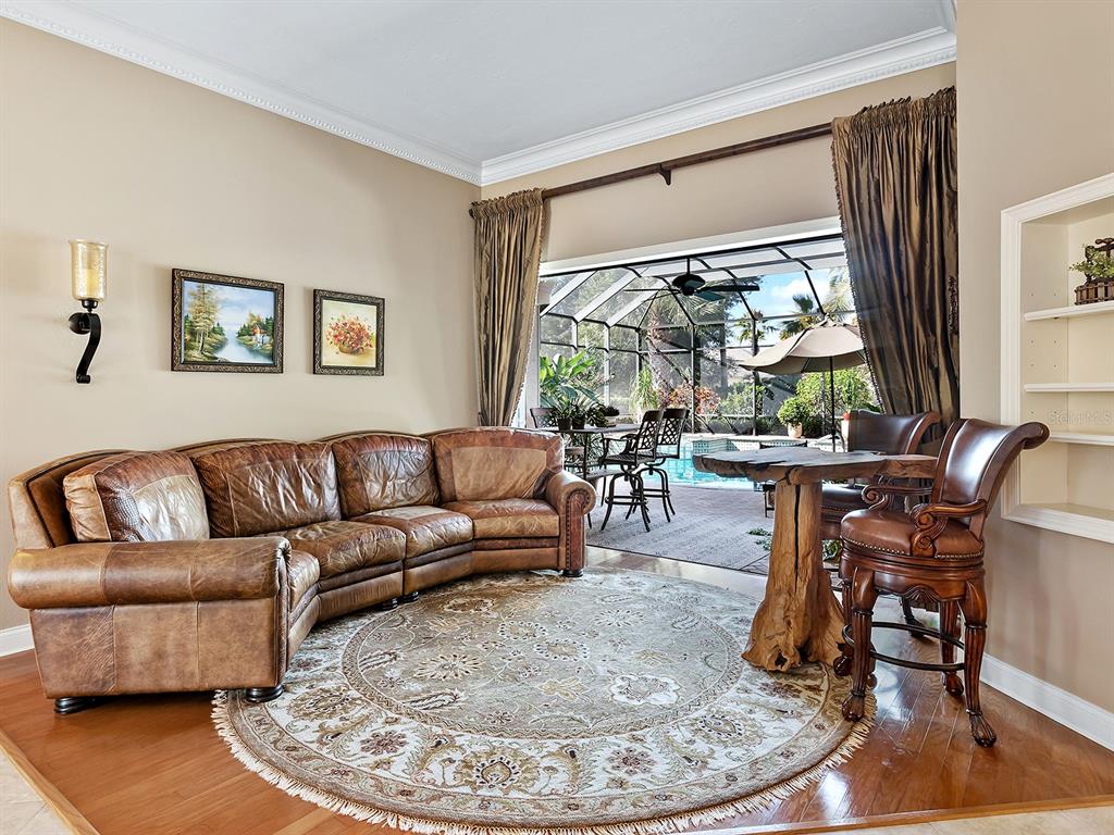 10528 Cheval Place Lakewood Ranch, FL 34202 - Photo 12 of 71 a living room with furniture and a large window