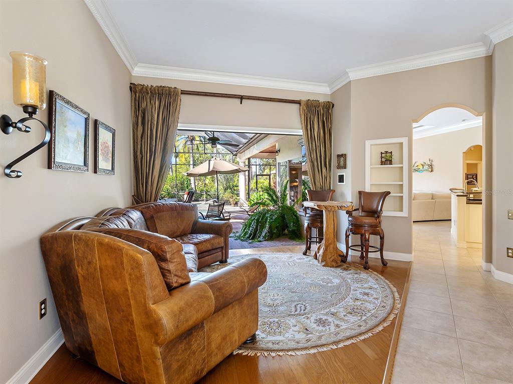 10528 Cheval Place Lakewood Ranch, FL 34202 - Photo 15 of 71 a living room with furniture and a large window