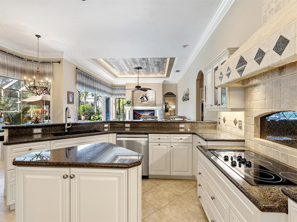 10528 Cheval Place Lakewood Ranch, FL 34202 - Photo 21 of 71 a kitchen with a sink stove and cabinets